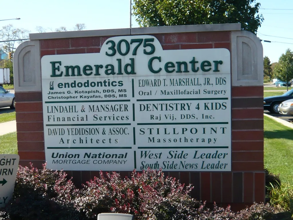 Office tour picture of the sign/directory in front of the building outside